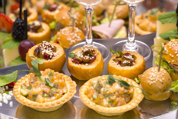 Canapes of cheese vegetables meat and seafood