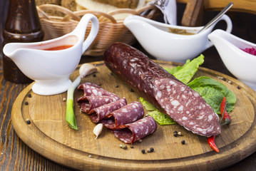 sausage on a wooden plate in a restaurant