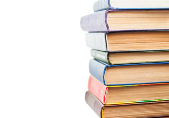 Stack of old books isolated on white
