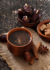 coffee and eastern dates on old wooden background