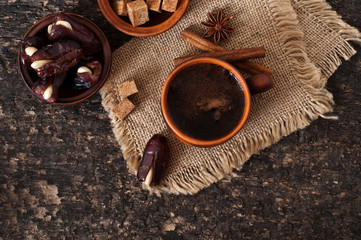 coffee and eastern dates on old wooden background
