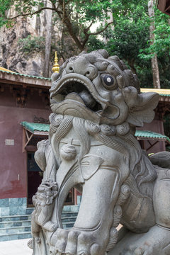 Antique chinese lion statue in chinese temple