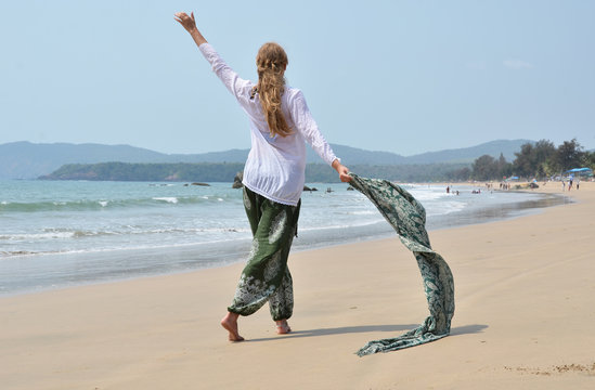 Young woman in the traditional punjabi dress on Agonda beach. So