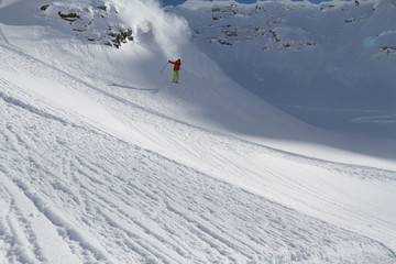 Skier in deep powder, extreme freeride