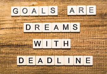 Act. Goals Are Dreams With Deadline card with sky background