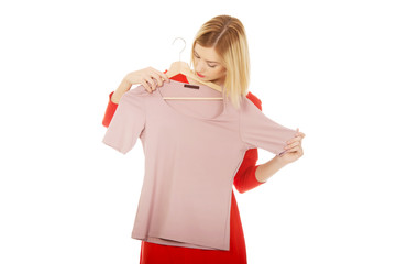 Woman deciding what to buy.