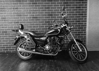 Obraz na płótnie Canvas Motorcycle in front of Interior Brick Wall