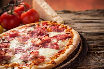 Delicious italian pizza served on wooden table