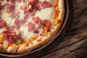 Delicious italian pizza served on wooden table