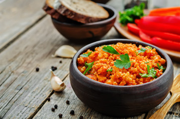 millet porridge with tomato sauce, garlic and parsley