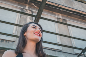 Fototapeta premium Beautiful brunette posing in an industrial context