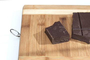 Fototapeta premium Tile brown milk chocolate on a cutting board
