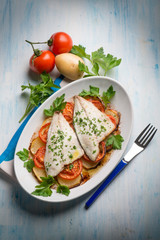 fish with potatoes and tomatoes