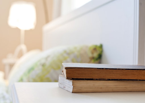 bedroom with books on nightstand