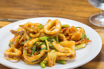 fried squid in yellow curry powder, thai food.