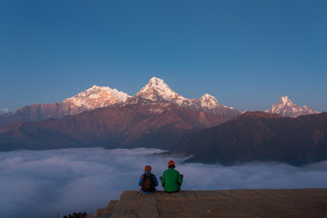 Fototapeta premium Men meditating in Himalaya Mountains View from Poon Hill 3210m a