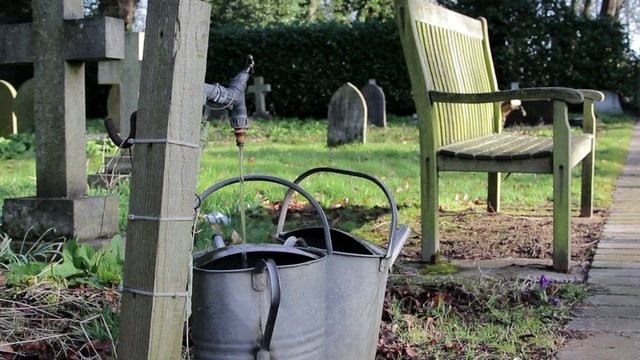 Tap Filling Watering Can in Rural Church Yard With Bench - Beautiful Morning Light - Village Town Scene - English Countryside Nature Backgrounds
