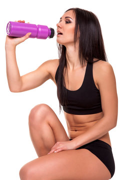 Fitness woman with bottle of water - Stock Image