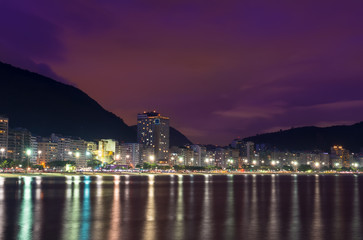 Naklejka na ściany i meble Night view of Copacabana beach in Rio de Janeiro, Brazil
