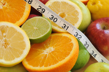 Measuring tape and fresh fruit