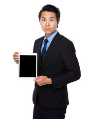 Young asian man holding his tablet