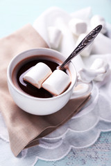 Hot chocolate with marshmallows in mug,