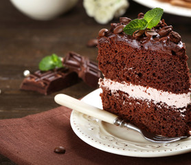 Delicious chocolate cake on table close-up