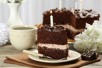 Delicious chocolate cake on table on light background