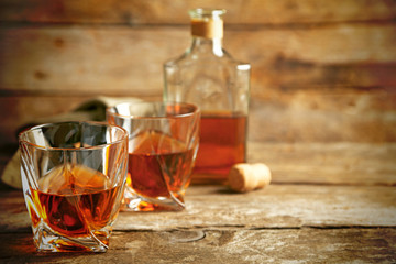 Whiskey on wooden background