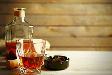 Whiskey on wooden background