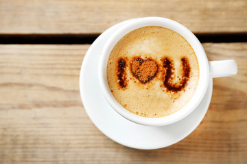 Cup of coffee on old wooden table