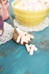 Sweet candies on wooden table, closeup