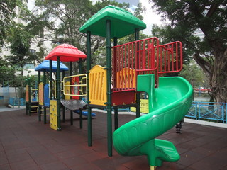 A picture of a colorful playground in park