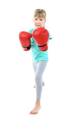 Little girl with boxing gloves isolated on white