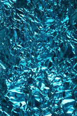 Crumpled color foil texture background