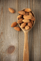 Almonds in wooden spoon