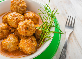 Bowl with meatballs and tomato sauce