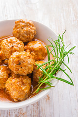 Bowl with meatballs and tomato sauce