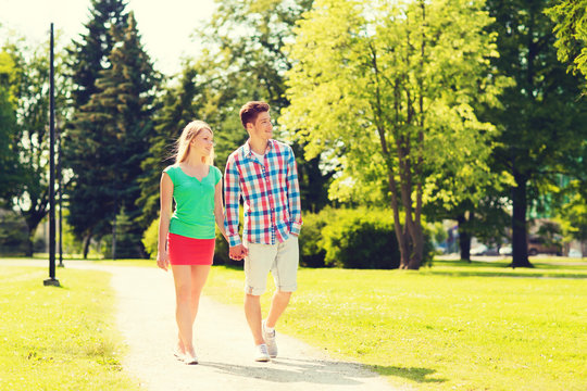 Smiling Couple Walking In Park