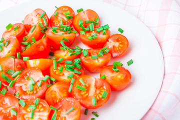 potatoes with chives on white plate