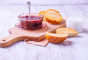 Toasts with Strawberry Jam on the kitchen board