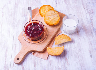 Toasts with Strawberry Jam on the kitchen board