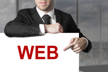 businessman pointing on sign web