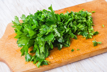 leaf of parsley on a wooden table