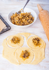 ingredients to prepare the dumplings on a white kitchen table