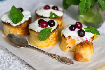 Curd pudding with candied fruit and fresh berries. Soft focus