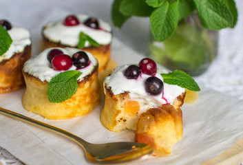 Curd pudding with candied fruit and fresh berries. Soft focus