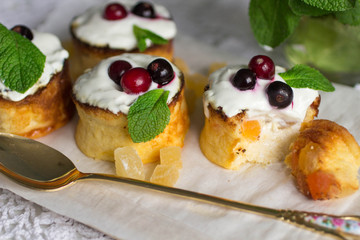 Curd pudding with candied fruit and fresh berries. Soft focus