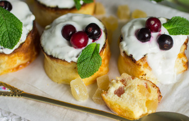 Curd pudding with candied fruit and fresh berries. Soft focus
