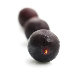 juicy black currant on a white background